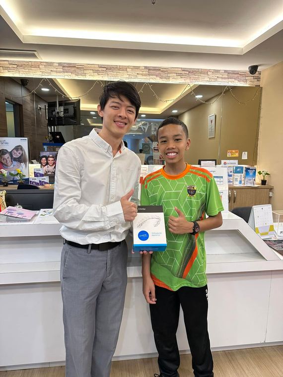 Dr. Arthur with a young Invisalign patient at iCare Dental IOI City Mall Putrajaya