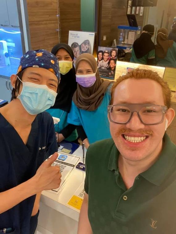 Dr. Arthur with the team and a patient at iCare Dental IOI City Mall Putrajaya